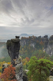 View over the rock tower Wehlnadel and the valley Wehlgrund in autumn, Saxon Switzerland,