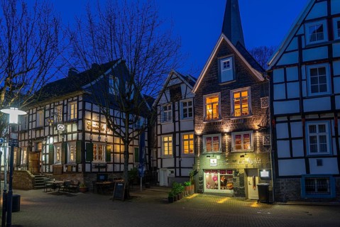 The old town of Hattingen, Emschestraße, St. George's Church, leaning church tower, half-timbered