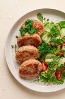 Fried cutlets, turkey, with vegetable salad, top view, no people