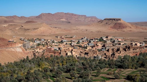 Oasis with traditional mud houses and date palms, on the edge of the Todra Gorge or Gorges du