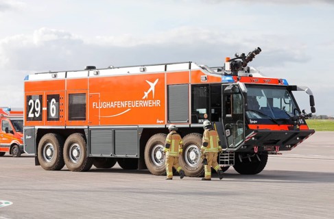 Airport fire brigade fire engine on the BER tarmac during an EASA emergency exercise. Emergency