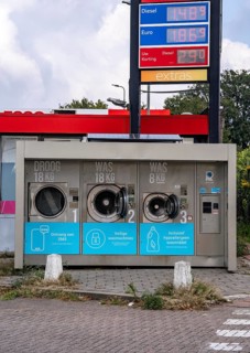 Self-service washing machines, for laundry, clothing, open 24 hours, around the clock, at a petrol