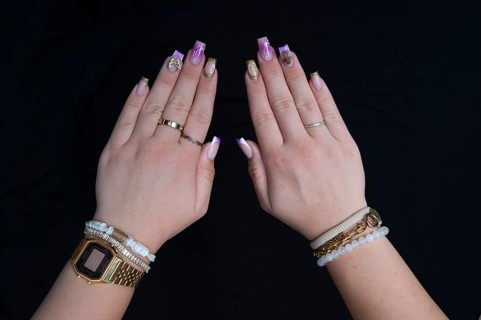Colourful fingernails of a young woman, on a black background, Baden-Württemberg, Germany, Europe