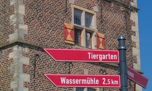 Signpost at Raesfeld moated castle, Münsterland, North Rhine-Westphalia, Germany, Europe