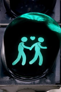 Green pedestrian traffic light with two men and heart, male traffic light couple, homosexual love,