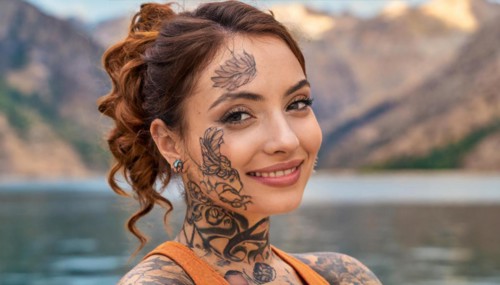 Portrait of a smiling woman with eye-catching tattoos against a mountain backdrop, AI generated, AI