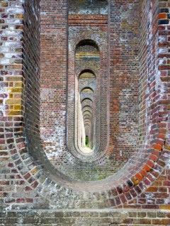 Pattern of brick arches in the railway viaduct opened in 1849, Chappel, Essex, England, United