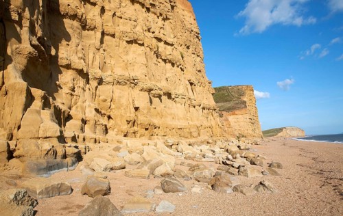 Sandstone cliffs and beach West Bay, Bridport, Dorset, England, UK