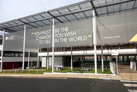 University of Suffolk buildings, Ipswich, England, UK with Mahatma Gandhi quotation about change in