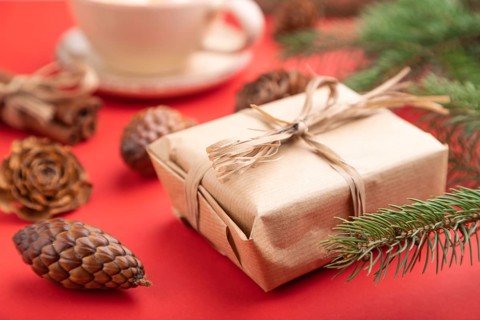 Christmas or New Year composition. Decorations, box, cinnamon, cones, fir and spruce branches, cup