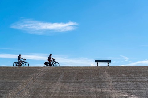 North Sea dyke near Westkapelle, cyclist on the Zeeuwse Wind Route cycle path, province of Zeeland,