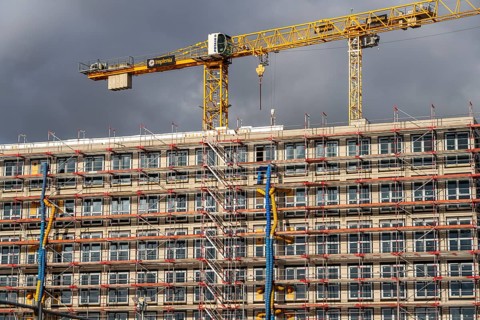 Large construction site, scaffolded shell of an office building complex, O-Werk Campus in Bochum,