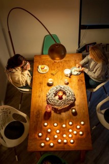Symbolic image energy saving, cold winter, energy crisis, cold flat, mother and daughter dressed