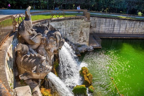 Fountain sculptures at the water basins in the garden of the royal palace Palazzo Reale, Italian