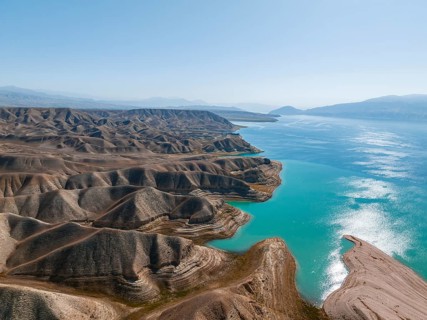 Barren landscape, aerial view, erosion landscape with canyons on the Naryn River, Toktogul