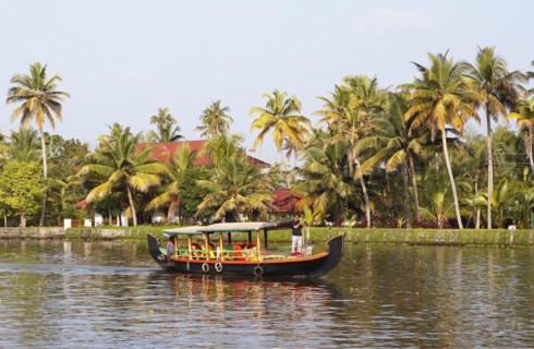 Traditional shikara boat on a canal in the canal system of the backwaters, Kerala, India, Asia