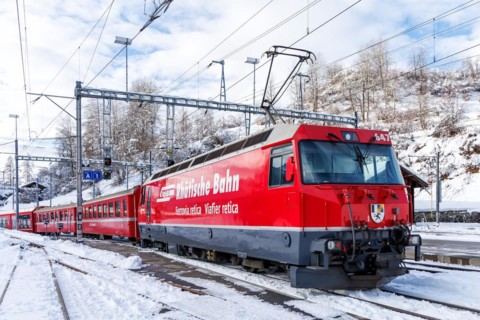 Rhaetian Railway train on the Albula railway Passenger train at Filisur station, Switzerland,