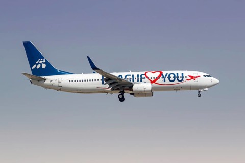 A Boeing 737-800 Smartwings aircraft with the licence plate OK-TVF and the Prague Loves You special