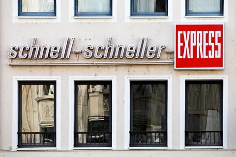 Writing on a wall of a house fast fast express, German newspaper, regional tabloid, Bonn, North