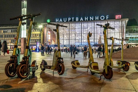 Cologne Central Station, station forecourt, evening, parked e-scooters, North Rhine-Westphalia,