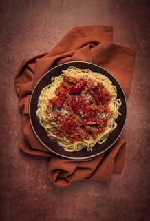 Spaghetti bolognese, with dried tomatoes, homemade, close-up