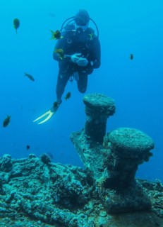 Diver on the upper deck, dive site wreck of the Thistlegorm, Red Sea, Egypt, Africa