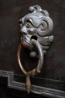 Lion's head, historical door knocker on a wooden door, Salem Castle, former imperial abbey, former