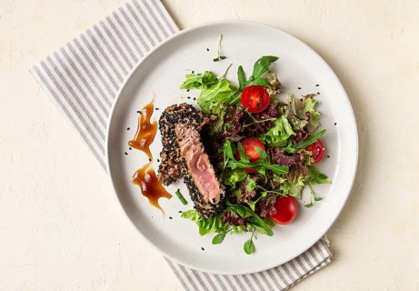 Vegetable salad, with fried tuna, in sesame seeds, healthy food, top view