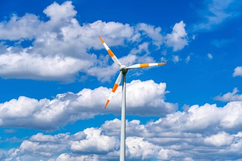Wind turbine, wind energy plant from the manufacturer Enercon, blue sky with many white clouds,