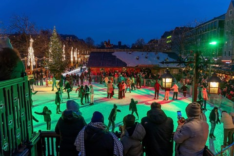 Ice rink at the Christmas market on the Heumarkt in the old town of Cologne, Sunday shopping in
