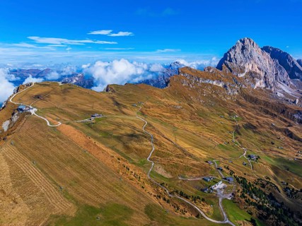 The Sas Rigais peak of the Odle group, alpine meadows, drone shot, Val Gardena, Dolomites,