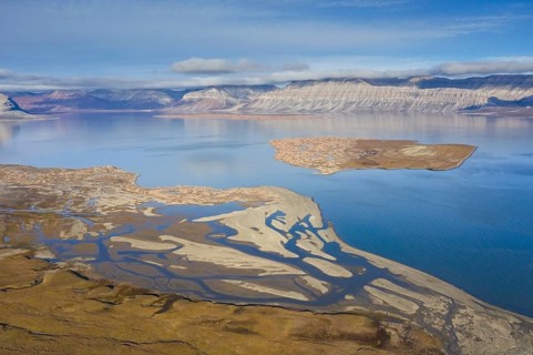 Aerial view over Ekmanfjorden, fjord in the Nordre Isfjorden National Park in summer, Nordfjorden,