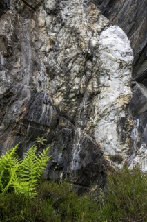 White quartz vein in rock face at the Ballachulish slate quarry in Lochaber, Highland, Scotland, UK