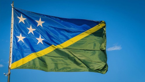 The flag of Solomon Islands, Solomon Islands, island nation in the South Seas, flutters in the