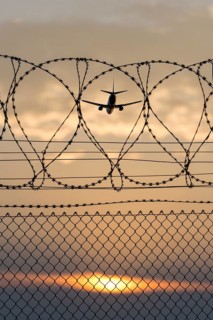 Symbolic image security, passenger aircraft taking off, security fence, Stuttgart Airport,