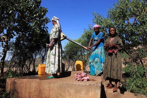 Amhara region, locals fetching water from a well, Ethiopia, Africa