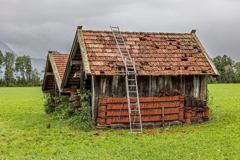 Roof of a small hut destroyed by hail, storm on 26.8.23 near Benediktbeuern, Bavaria, Germany,