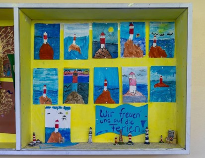 Fourth grade classroom, after school, the building is older but in good condition, art project at