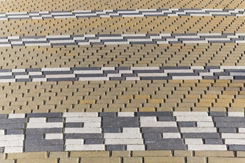 Striped pattern of rectangular tiles in the park