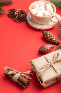 Christmas or New Year composition. Decorations, box, cinnamon, cones, fir and spruce branches, cup