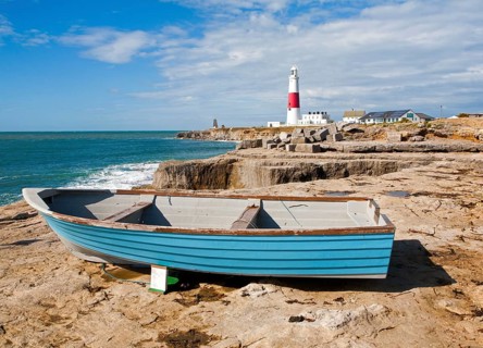 Red and white lighthouse on the coast at Portland Bill, Isle of Portland, Dorset, England, United