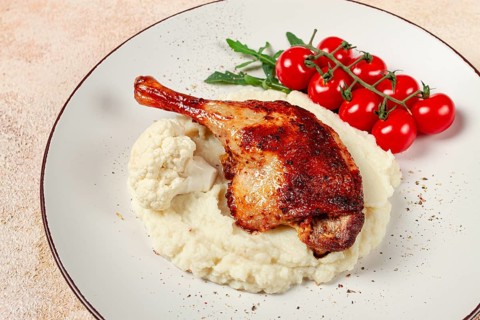 Fried duck shank, cauliflower puree, cherry tomatoes, homemade, no people
