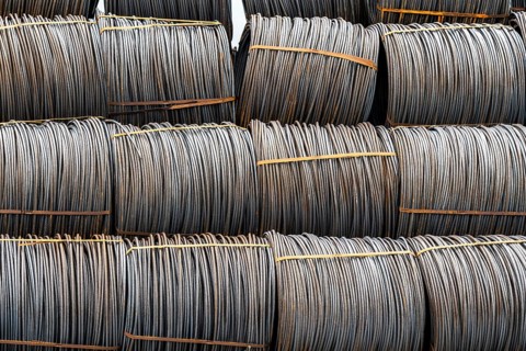 Steel wire, coils, waiting for further processing in the Rhine-Ruhr harbour in Mülheim an der Ruhr,