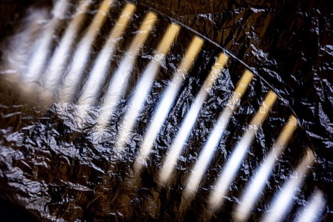 Car Grille on the Front of a an Old Classic Car Covered with Plastic Protection in Switzerland