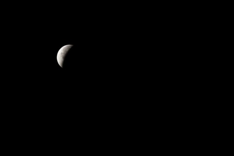 The moon with a partial lunar eclipse, taken in the Swiss mountains, Switzerland, Europe