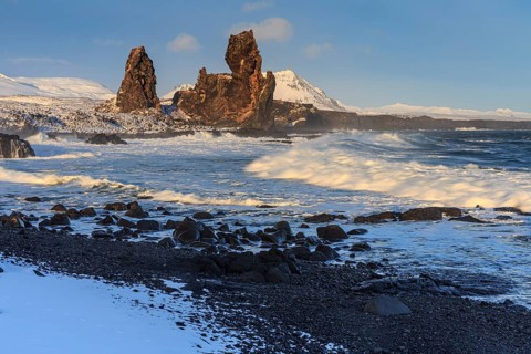 Rocks and surf on the coast, evening light, sun, snow, winter, Arnarstapi, Snaefellsnes,