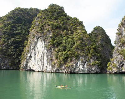 Yellow kayak and the karst rocks in Lan Ha Bay, Halong Bay, Vietnam, Asia