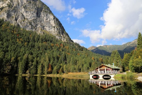 The picturesque Pflegersee lake near Garmisch, with the mountain inn in the background