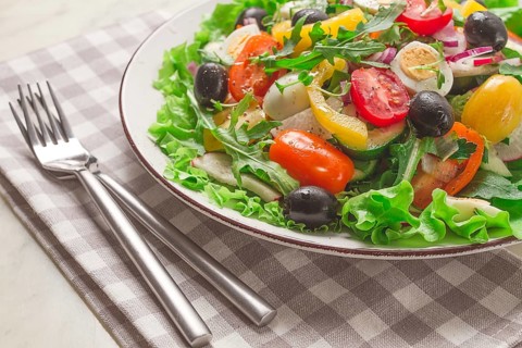 Vegetable salad, with quail eggs and olives, fresh, close-up, no people