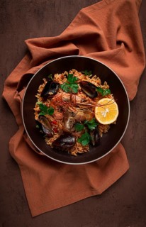 Seafood paella, shrimp and mussels risotto, rice, homemade, top view, no people